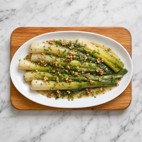 Steamed leeks dressed with vinaigrette, walnuts, and chives