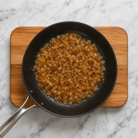 Onions caramelizing until deep golden in butter
