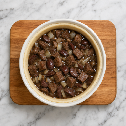 Beef and kidney filling packed into a pastry-lined pudding basin