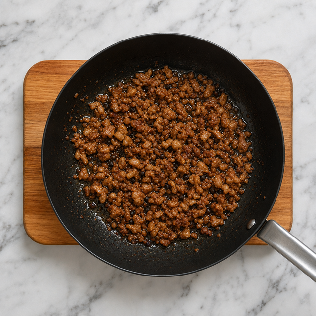 Crisp-edged Sichuan pepper pork topping in a skillet